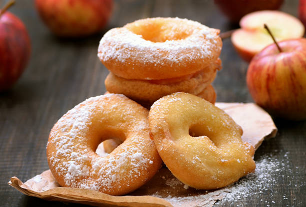 istock Apple rings over baking paper on wooden table 611298636