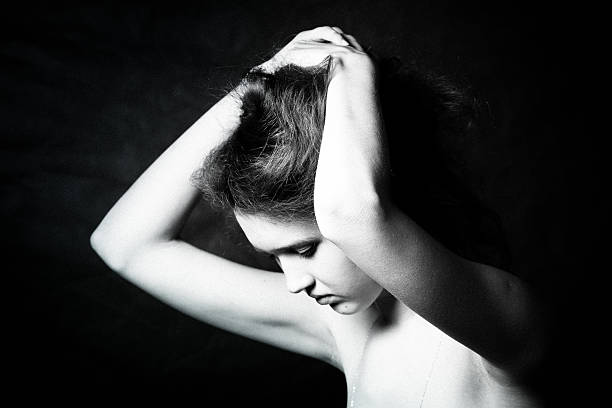 istock black and white noir style image beautiful young woman 611300462