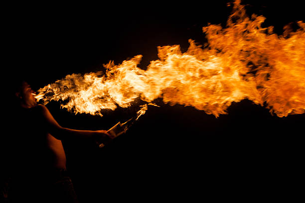 istock fire-show, man in action with fire 611300494