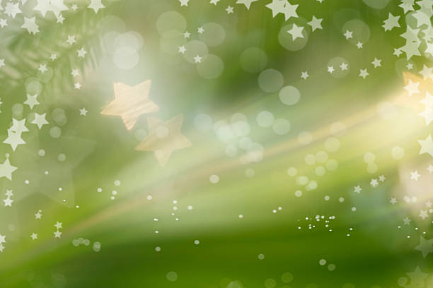 Green Defocused Light Background For Christmas With Stars