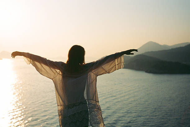 Woman on the background of picturesque bay at sunset, Croatia