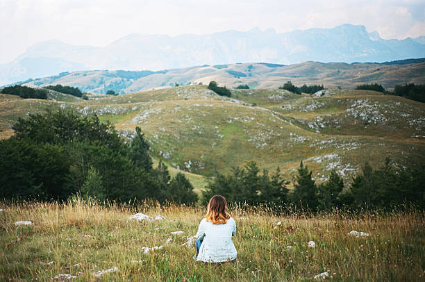 Woman looking at view in Durmitor National Park, Montenegro 