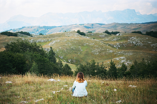 Woman looking at view in Durmitor National Park, Montenegro 