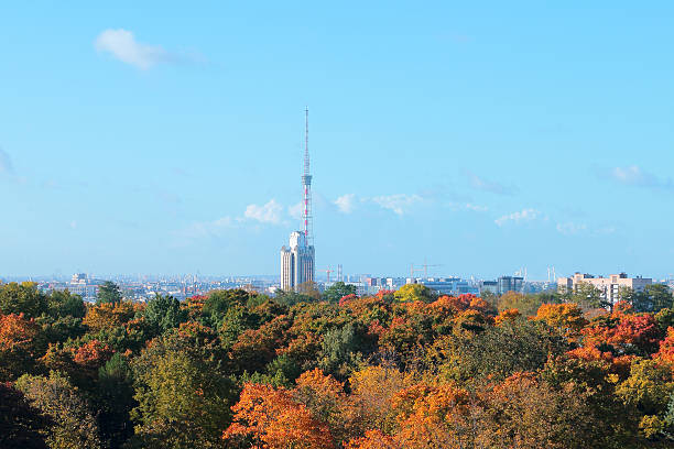 istock Beautiful bright autumn city scape and communication tower building 611302276