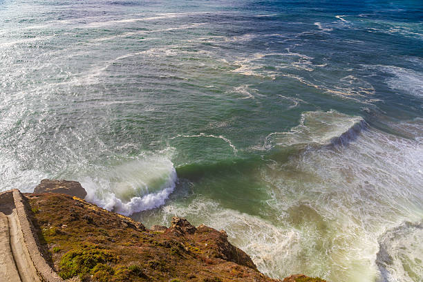 istock Top view of isolated emerald ocean waves with white 611304380