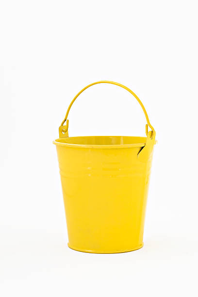 istock yellow metal bucket decorative isolated on white background 611304960