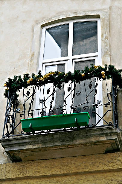 istock Balcony decorated Christmas fir garland 611306182