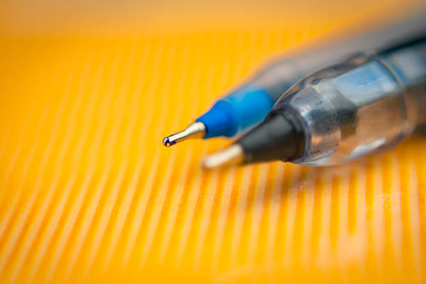 istock Pen on the polished  surface, with blurred background 611307378