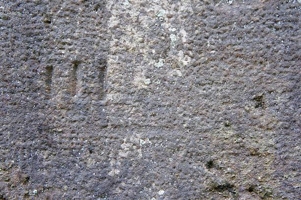istock Gray Cut Stone Wall with Markings 611307390