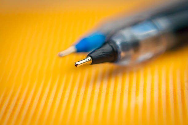 istock Pen on the polished  surface, with blurred background 611307402