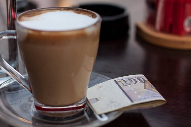 cup of coffee and macedonian paper money - denar imagens e fotografias de stock