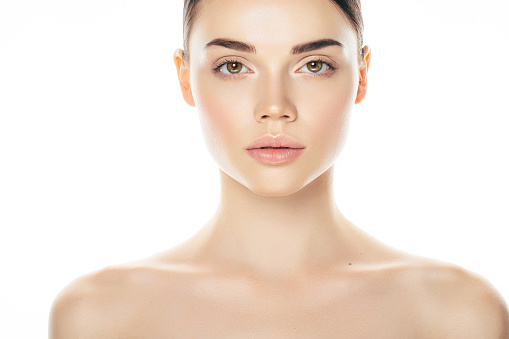 Indoor shot of young beautiful woman on light background. Natural beauty