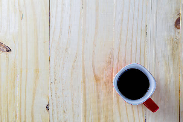 istock Coffee cup top view on wooden table background 611311120