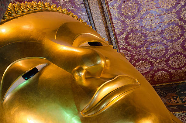 istock Reclining Buddha Face in Wat Pho Bangkok Thailand 611312922
