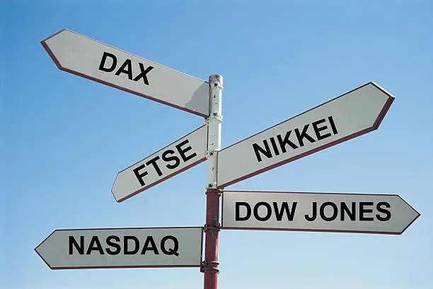 Photo of Sign post with various stock exchanges written on them