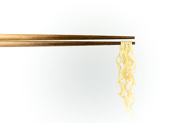 istock chopsticks noodles isolated on white background 611313586