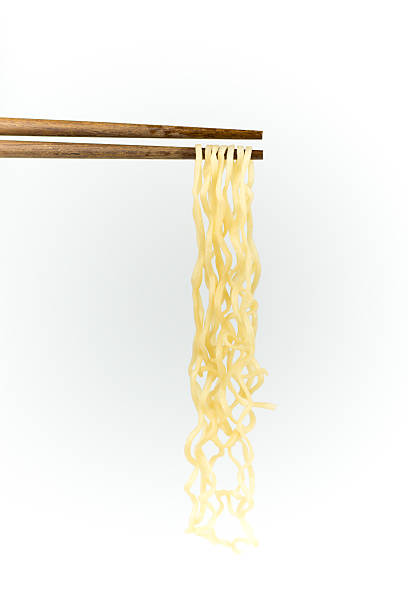 istock chopsticks noodles isolated on white background 611314080