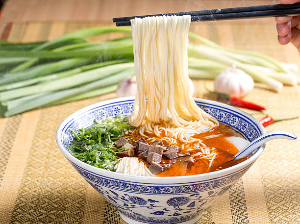 istock Hot instant noodles with cube beef and herbs on the 611317032