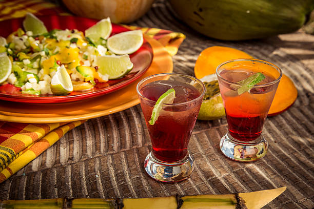 istock Red glasses of fruit cocktail in Thai style with orange 611317272