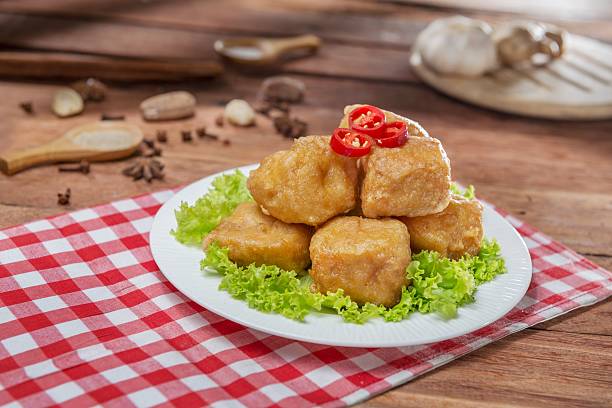 istock Plate of fried fish balls with cabbage on the table 611319426