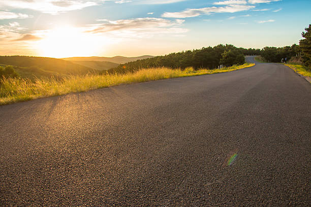 istock Rural road in the sunset 611319936