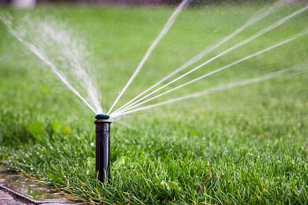 istock nozzle automatic watering system against a background of green g 611321574