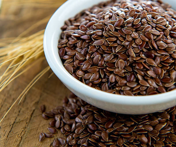 istock flaxseeds in white bowl on wood table 611323616