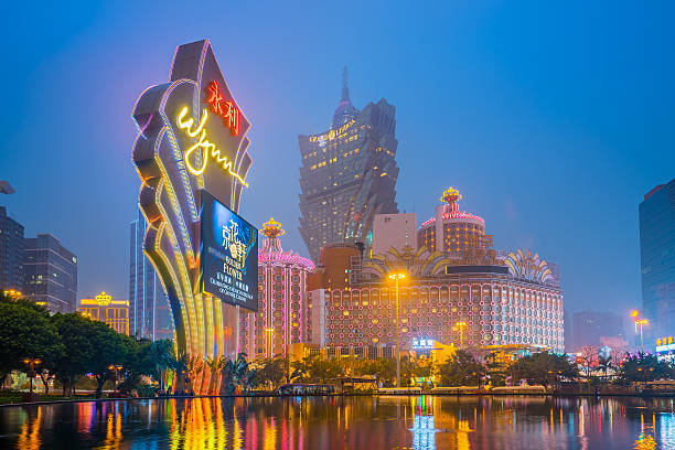 Macau city skyline at night Macau, Macau S.A.R. - March 12, 2016: Buildings of Macau Casino on March 12, 2016, Gambling tourism is Macau's biggest source of revenue, making up about fifty percent of the economy. wynn las vegas stock pictures, royalty-free photos & images