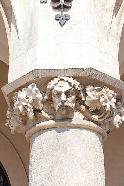 istock Decorative head of the column, Cloth Hall , Krakow, Poland 611327412