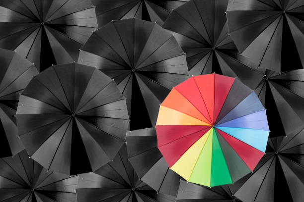 istock Holding colorful umbrella for saving money. 611327640