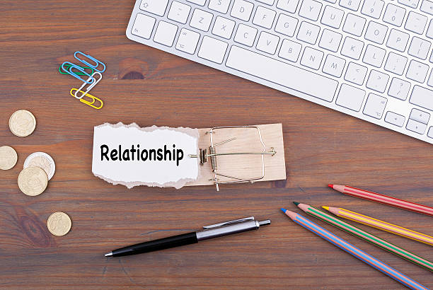 istock Relationship. Mousetrap on the office desk 611329074