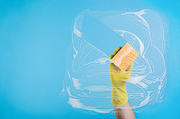 istock Hand cleaning a window or glass 611330208