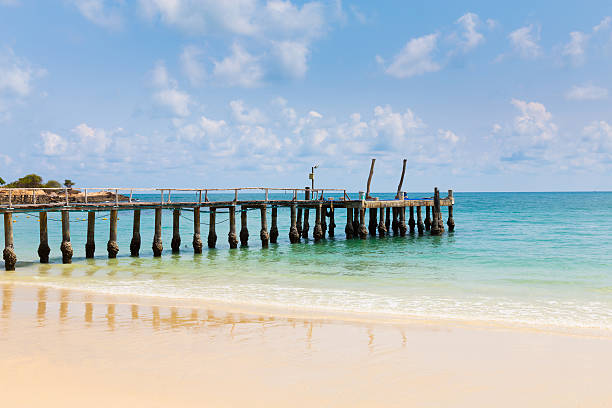 istock Fishing boat jetty over the beach 611332468