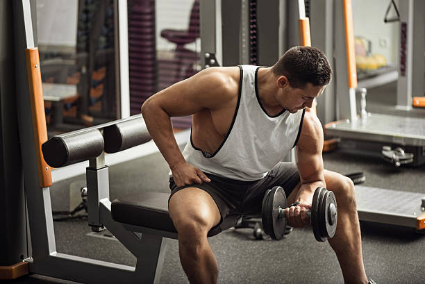istock Strong professional weightlifter lifting a dumbbell 611332852