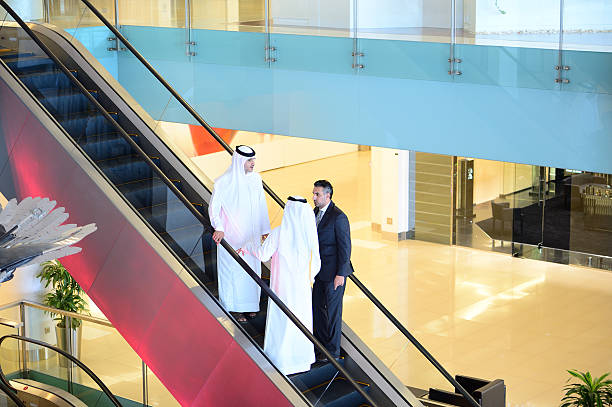 istock Three arab business men entering building 611334200
