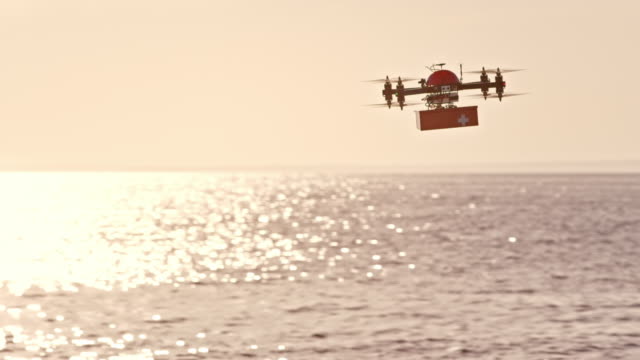 SLO MO UAV transporting first aid kit above the sea