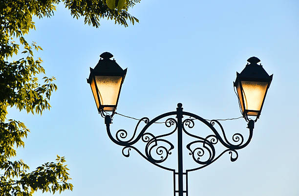 istock Low Angle View Of Illuminated Street Light Against Clear Sky 611464351
