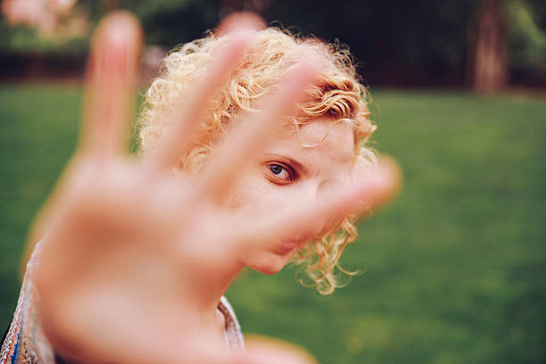 istock Young Woman Hiding Face With Palm 611464603