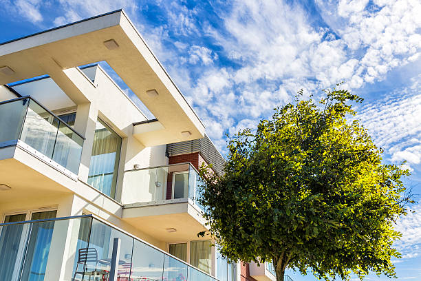 istock Modern white apartment building in summer 611591022