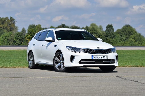 Leipheim, Germany - August 30th, 2016: Kia Optima SW stopped on the road during the test. This vehicle is the fastest combi in Kia offer. The motor of Optima provides 245 PS of power, which can propel it from 0 to 62 mph in 7,6 seconds.