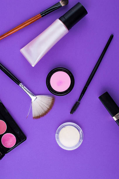 istock cosmetics brush lipstick shade on a purple background 611592214