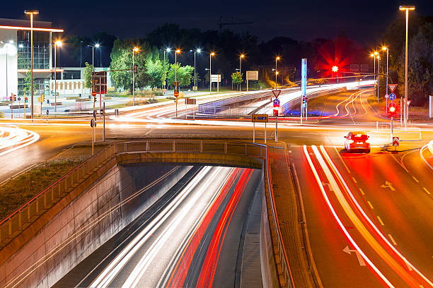 istock Expressway interchange with traffic lights at rush hour, at dusk 611592252