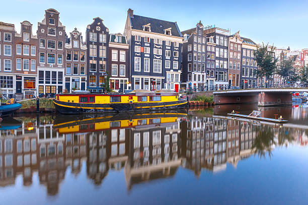 istock Amsterdam canal Singel with dutch houses 611592616
