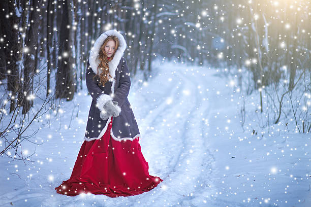 Beautiful young woman. Fairy tale girl in sheepskin coat in magic forest. Copy space.