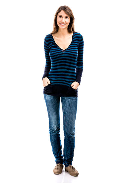 istock Beautiful woman smiling and standing over a white background 611596596