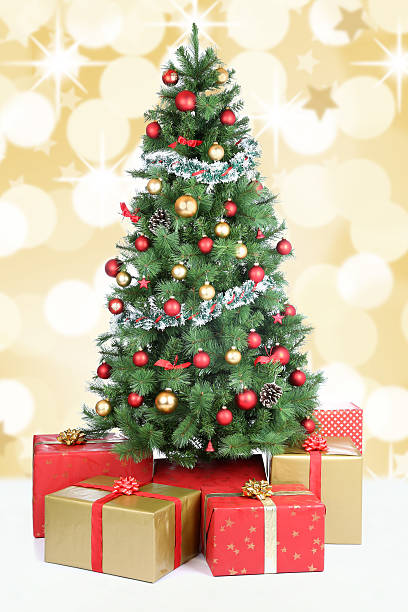 istock Christmas tree background snow golden balls decoration 611597918