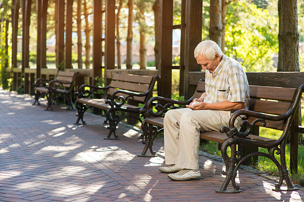 istock Elderly man with medicine bottle. 611598062