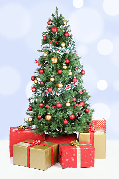 istock Christmas tree background snow snowing golden balls decoration 611598560
