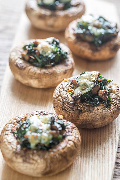 istock Baked mushrooms stuffed with spinach and cheese 611601128