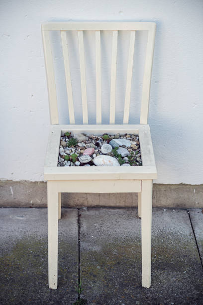 handmade decoration chair with stones and plants